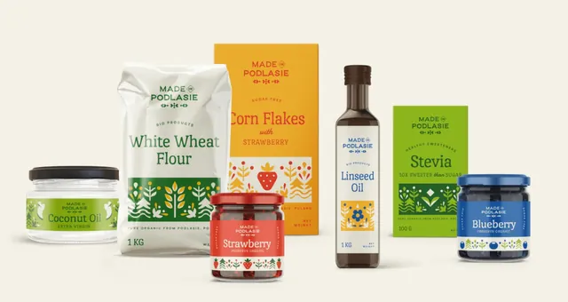 Siedem produktów Made in Podlasie: olej kokosowy, mąka, płatki, dżem truskawkowy, olej lniany, stewia i dżem jagodowy.